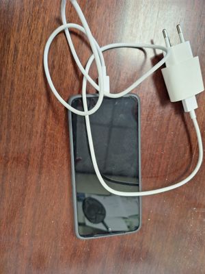 a cell phone that is connected to a charger