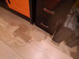 a wooden floor that has been damaged by the water