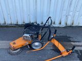 an image of a street sweeper laying on the ground