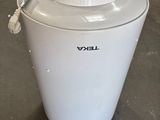 an image of a white ice cream maker in a warehouse