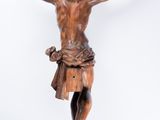 an image of a wooden statue of jesus on a cross