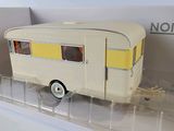 a model of a small trailer in a clear box