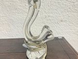 an image of a glass pipe sitting on top of a wooden table