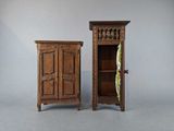 pair of antique wooden cupboards with open doors on each side of them