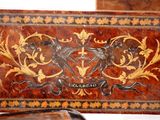 a wooden box with a decorative design on it