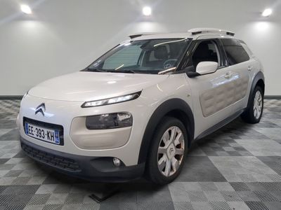 the white citrole is parked on a checkered tile floor