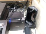 a lot of electronics that are sitting on a desk
