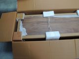 a cardboard box with a piece of wood inside of it