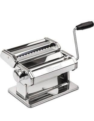 a close up of a pasta machine on a white background
