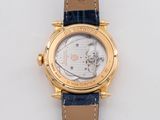 a close up of a watch on a white surface