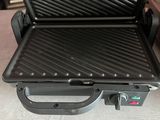 a grill that is sitting on the floor in the room