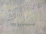 graffiti on the wall of a building with writing on it