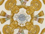 a close up of a yellow and white plate with a design on it