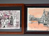 deux tableaux accrochés au mur au-dessus d'un lit