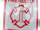 a fire rescue sticker on the back of a fireman ' s helmet