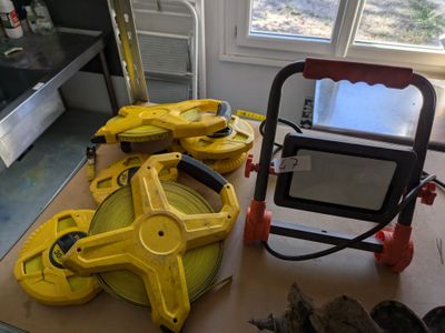 a lot of tools sitting on a table in a room