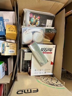 a cardboard box filled with assorted items in a room