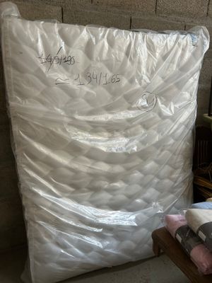 a mattress that has been wrapped up in plastic