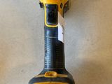 a close up of a cordless drill on a table