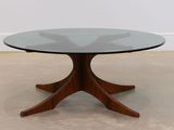 an image of a glass table with a wooden base