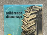 a poster of a tractor tire on the ground
