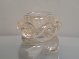 a clear glass vase sitting on top of a table