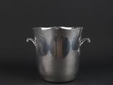 silver ice bucket with handles on a black background