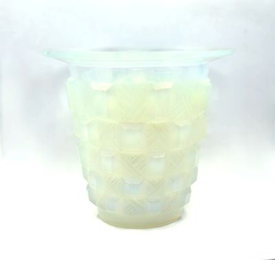 a glass vase that has a lot of small pieces of glass in it
