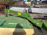 an image of a green tractor with a big blade on it