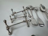 a lot of silver spoons and spoon spoons on a table