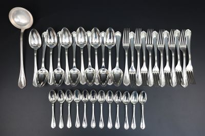 a close up of a bunch of silver spoons and forks