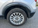 a close up of a car ' s tire on the pavement
