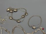many different types of jewelry on the table