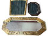 a mirror, a mirror and a mirror on a white surface