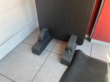 two pieces of metal on the floor next to a door