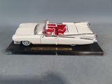 an image of a model of a white car with a red seat