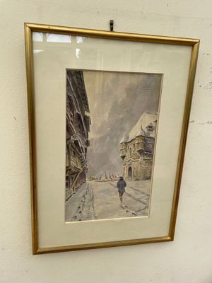 framed picture of a person walking down a street in a city