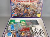 the contents of a board game in a box on a table