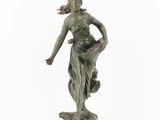 an image of a statue of a woman holding a flower