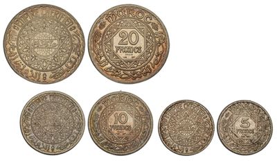 a group of five different coins sitting on top of each other