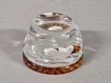 a small glass bowl with a fish inside of it