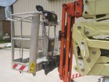 a picture of a scissor being used by a construction worker