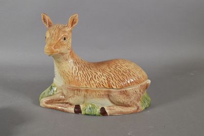 a ceramic animal that is sitting on the ground