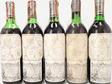 six bottles of wine are lined up in a row