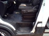 a white van with its doors open and the seats down