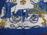 a blue and white scarf with a picture of a horse drawn carriage