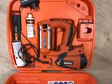 an orange case with tools in it on a wooden floor