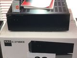 a black and white box with a remote on top of it