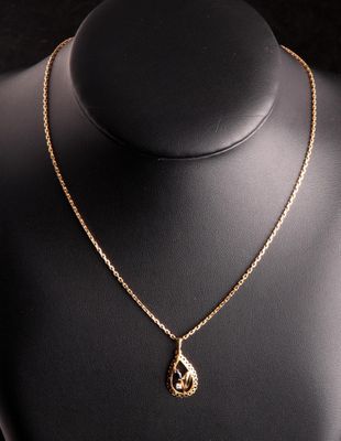 Chaîne en or jaune 18 carats (750 millième) à maille forçat et pendent - Photo 1