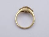 an image of a gold ring with two diamonds on it